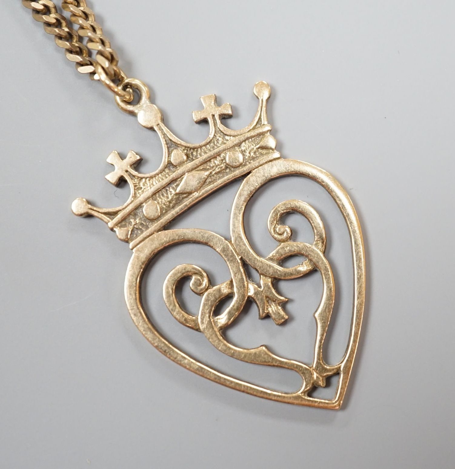 A 1970's Scottish 9ct gold Iona heart shaped pendant, 46mm, on a 9ct gold chain, 74cm